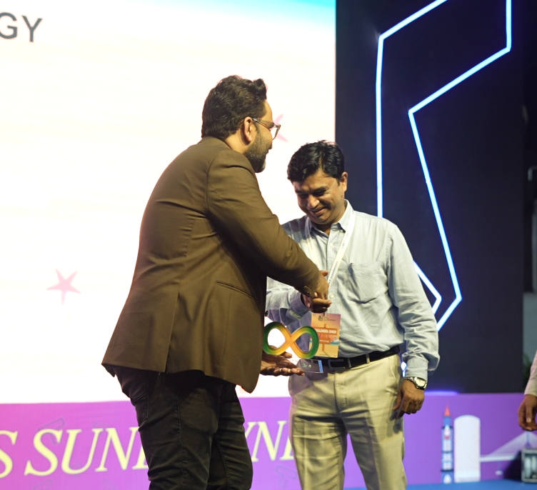 A leadership award being handed over on stage — opens a short video